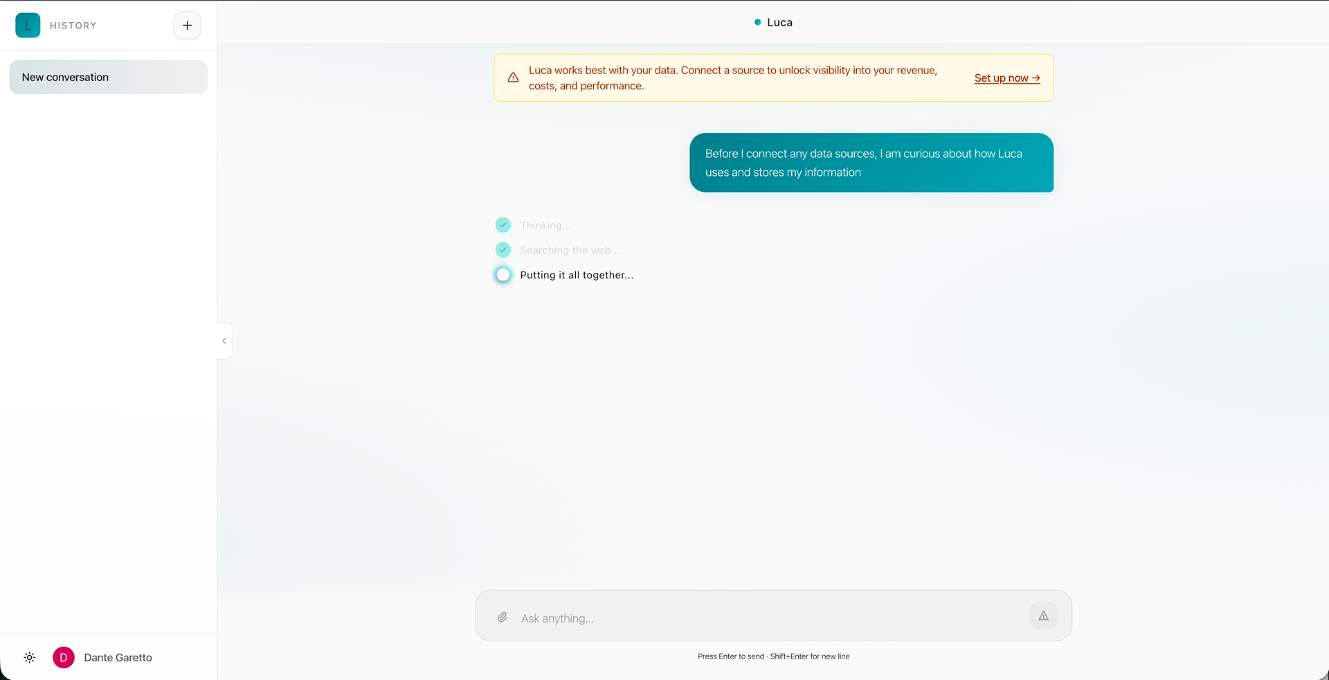 A sent question in a teal bubble above three status lines — ‘Thinking…’ and ‘Searching the web…’ checked off, ‘Putting it all together…’ still in progress.